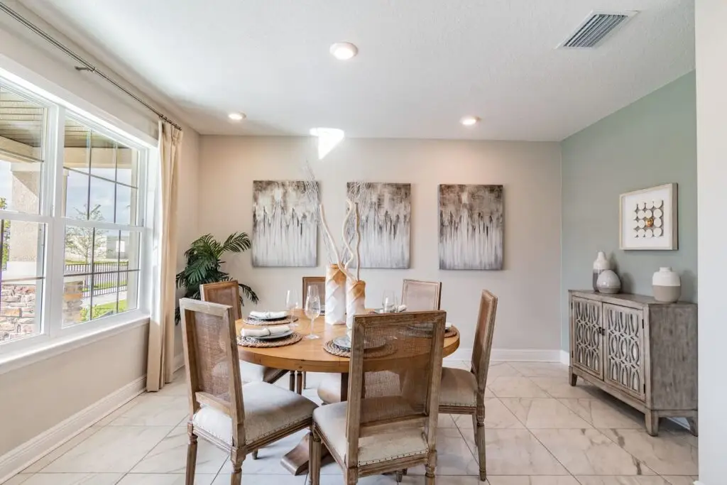 Elegant dining room with wooden table and chairs.